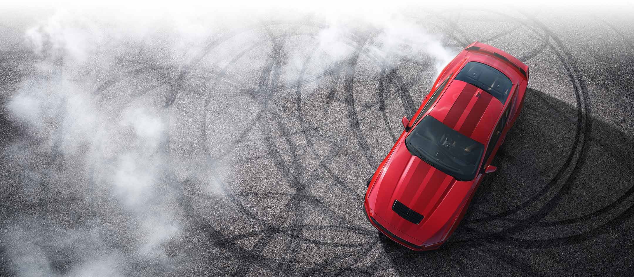 Overhead view of a 2024 Ford Mustang® model with tire tracks on pavement | Dotts Motor Co Inc in Clearfield PA