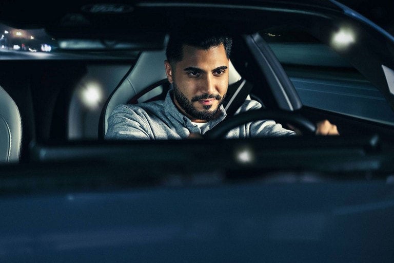 Person sitting in the driver’s seat of a parked 2024 Ford Mustang® coupe | Dotts Motor Co Inc in Clearfield PA