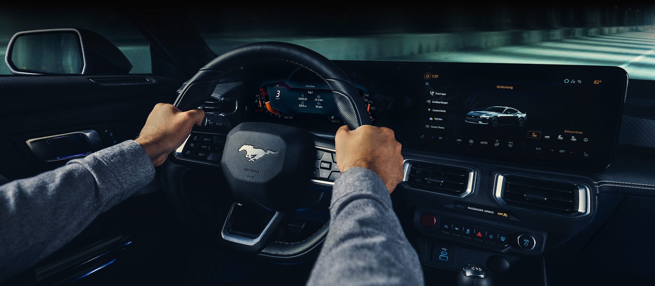 A 2024 Ford Mustang® model interior with a person driving | Dotts Motor Co Inc in Clearfield PA